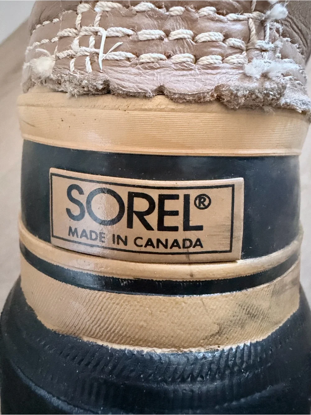 Sorel Tan and Black Winter Duck Boot Heel Detail